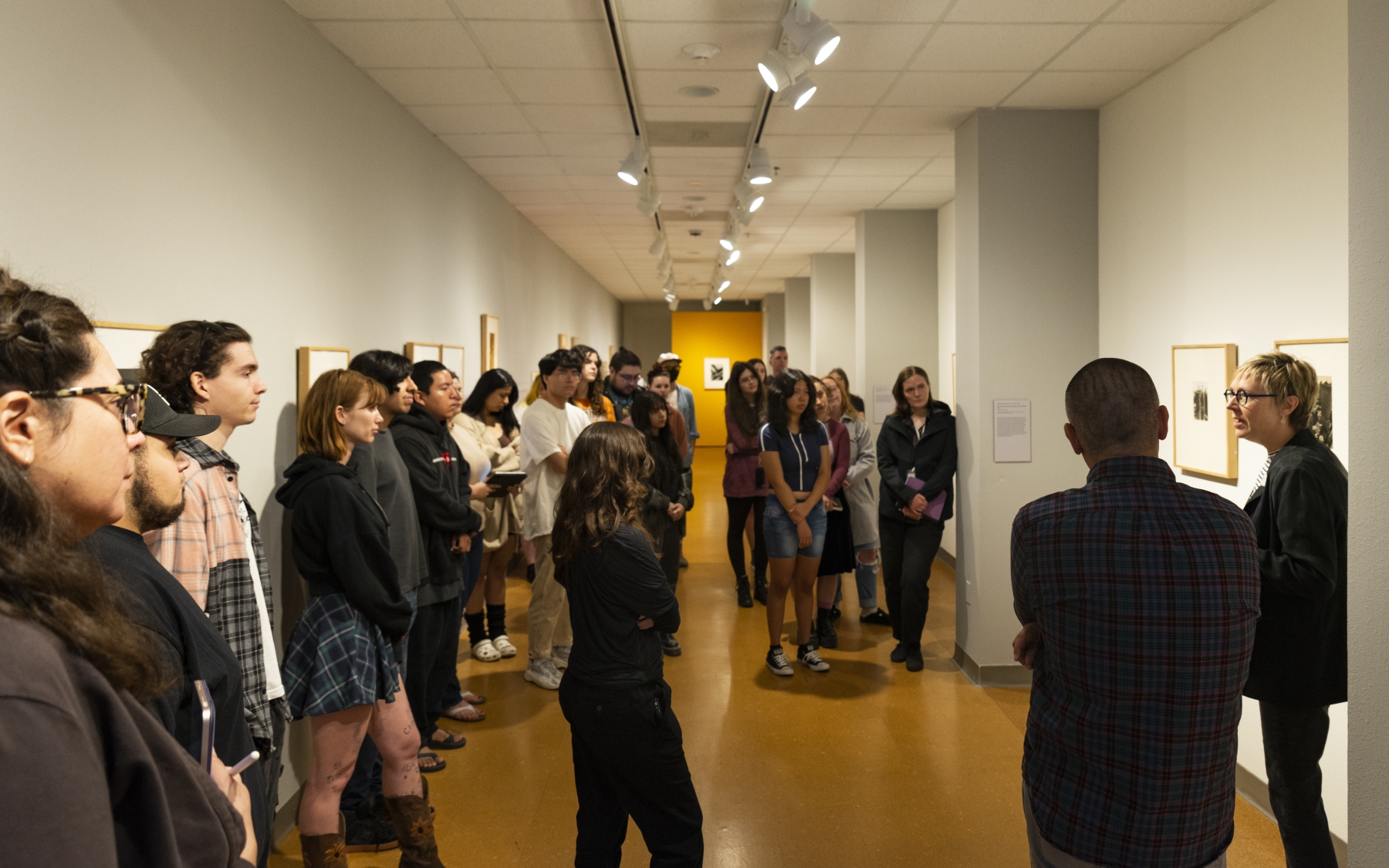 Kevin Mulhearn's class "Twentieth Century Photography” attends a tour with Curator Mary Statzer