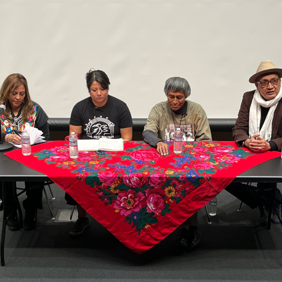 Panelists Violet Barton, Justine Teba, Petuuche Gilbert, and Daniel Flores y Ascencio seated at a table.
