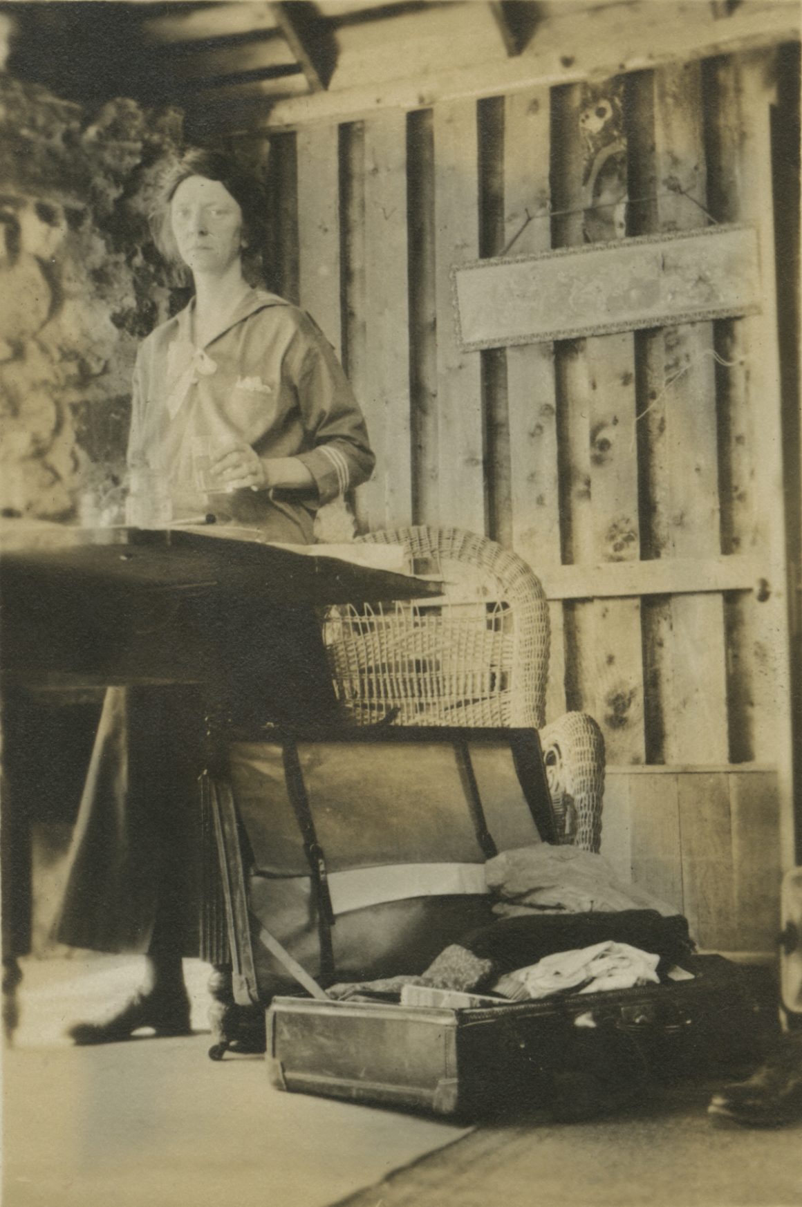 A black and white photograph of Raymond Jonson painting in Eldora Colorado, 1917.